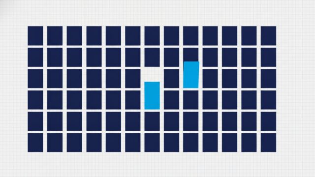 A field of domino tiles lying flat with only three or four tipped up on their edges
